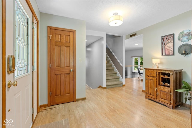 3479 Sugar Loaf Ct, Carmel, IN 46033 - entrance foyer with light wood finished floors and stairs