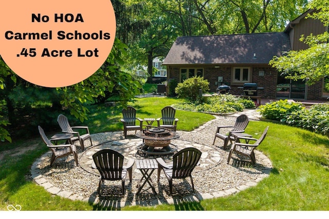 3479 Sugar Loaf Ct, Carmel, IN 46033 - view of patio featuring an outdoor fire pit