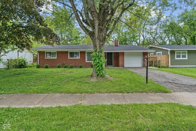 8109 E Penway St, Indianapolis, IN 46226 - ranch-style house featuring an attached garage, brick siding, driveway, and a chimney