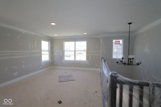 5517 Sienna Ct, Brownsburg, IN 46112 - unfurnished living room featuring baseboards, a chandelier, and recessed lighting