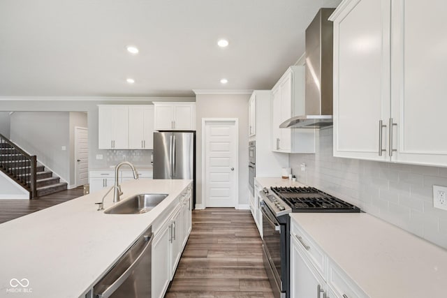 15418 Tattersalls Ln, Fishers, IN 46040 - kitchen featuring stainless steel appliances, wall chimney exhaust hood, light countertops, white cabinetry, and recessed lighting