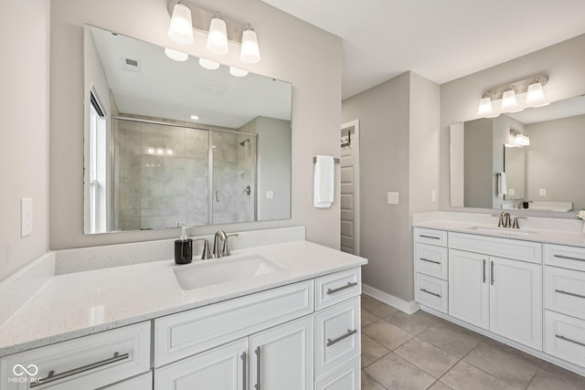 15418 Tattersalls Ln, Fishers, IN 46040 - bathroom featuring a shower stall, two vanities, and tile patterned flooring