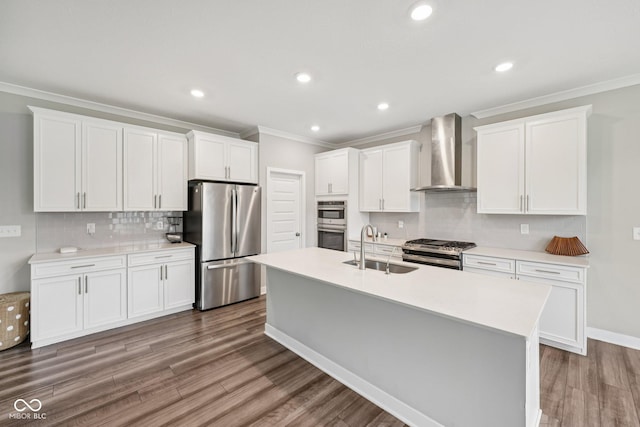 15418 Tattersalls Ln, Fishers, IN 46040 - kitchen with appliances with stainless steel finishes, wall chimney range hood, ornamental molding, tasteful backsplash, and a kitchen island with sink