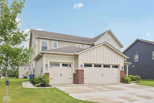 15418 Tattersalls Ln, Fishers, IN 46040 - view of front of property featuring an attached garage, board and batten siding, concrete driveway, a front lawn, and roof with shingles