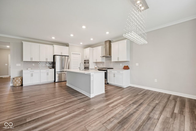 15418 Tattersalls Ln, Fishers, IN 46040 - kitchen with stainless steel appliances, wall chimney range hood, ornamental molding, a chandelier, and tasteful backsplash