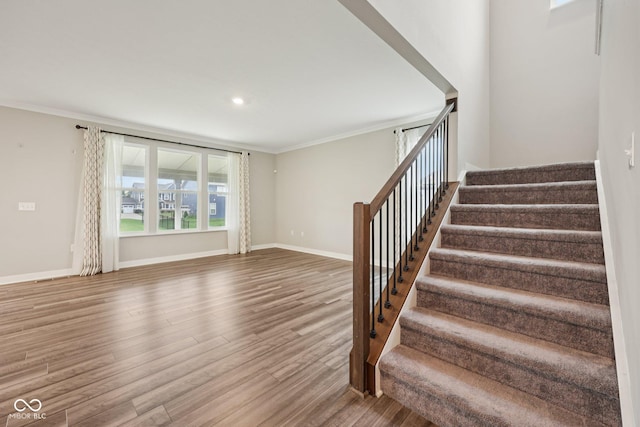 15418 Tattersalls Ln, Fishers, IN 46040 - staircase featuring wood finished floors, ornamental molding, and recessed lighting