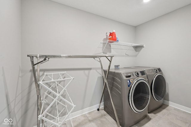 15418 Tattersalls Ln, Fishers, IN 46040 - laundry room with washing machine and dryer and baseboards