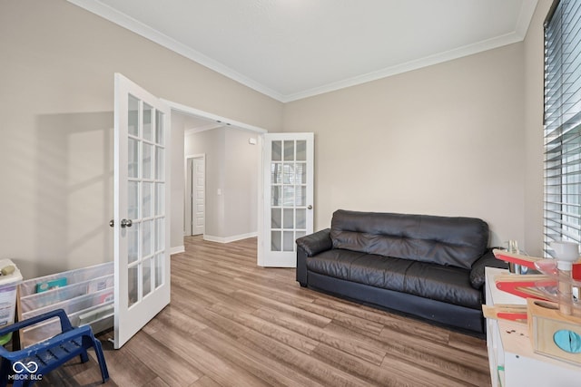 15418 Tattersalls Ln, Fishers, IN 46040 - sitting room featuring french doors, ornamental molding, and wood finished floors