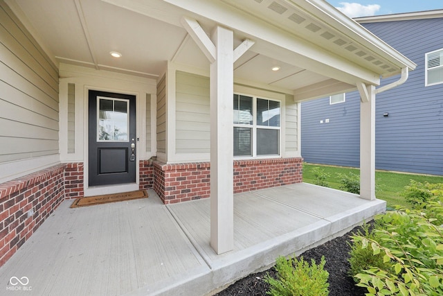 15418 Tattersalls Ln, Fishers, IN 46040 - doorway to property with covered porch and brick siding