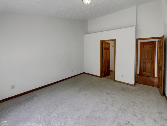 4825 May Ridge Ln, Indianapolis, IN 46254 - carpeted spare room with a textured ceiling and baseboards