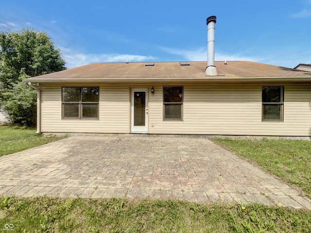 4825 May Ridge Ln, Indianapolis, IN 46254 - rear view of property with a patio and roof with shingles