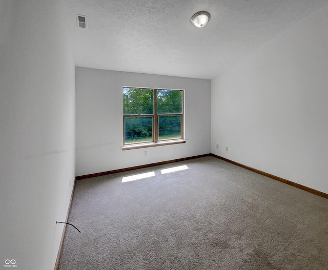 4825 May Ridge Ln, Indianapolis, IN 46254 - carpeted empty room with baseboards and a textured ceiling