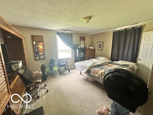 162 N Gladstone Ave, Columbus, IN 47201 - carpeted bedroom with a textured ceiling