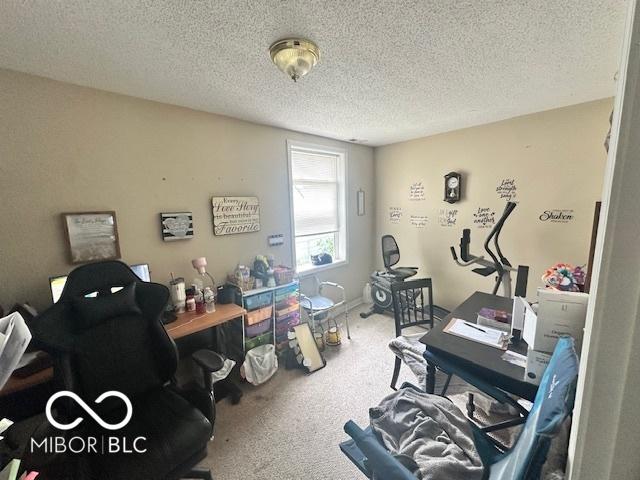 162 N Gladstone Ave, Columbus, IN 47201 - carpeted home office with a textured ceiling
