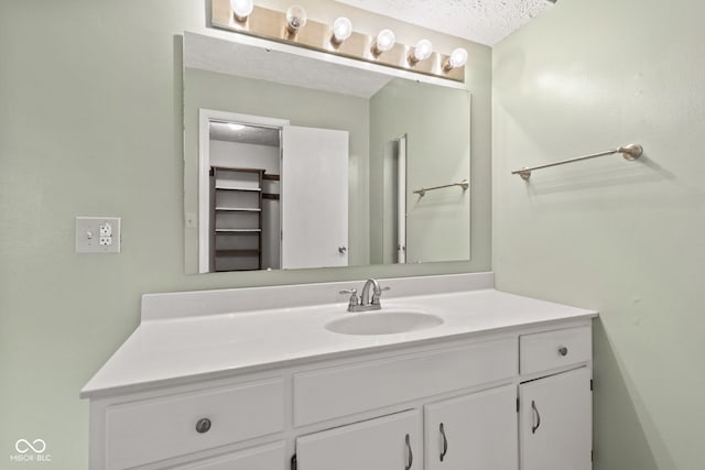 8934 Pinyon Ct, Indianapolis, IN 46260 - bathroom featuring vanity and a textured ceiling