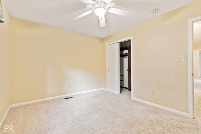 8934 Pinyon Ct, Indianapolis, IN 46260 - unfurnished bedroom featuring carpet flooring, a textured ceiling, baseboards, and a closet