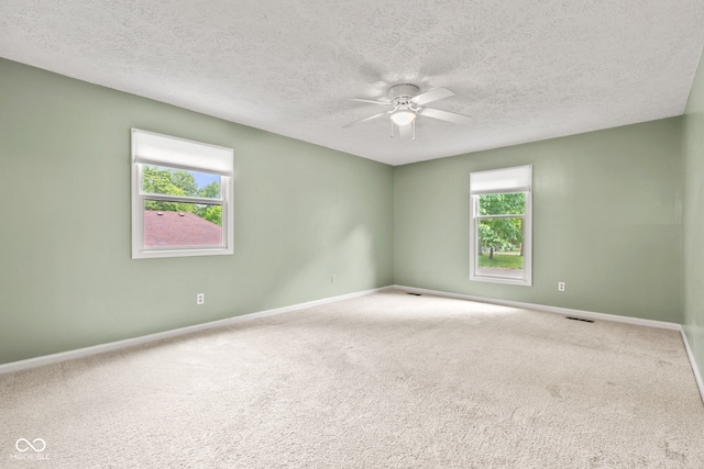 8934 Pinyon Ct, Indianapolis, IN 46260 - empty room featuring ceiling fan, baseboards, a textured ceiling, and carpet flooring