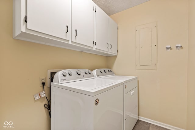 8934 Pinyon Ct, Indianapolis, IN 46260 - washroom featuring electric panel, cabinet space, washing machine and clothes dryer, and baseboards