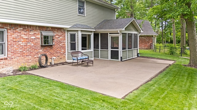 8934 Pinyon Ct, Indianapolis, IN 46260 - back of property featuring a sunroom, a patio area, and roof with shingles