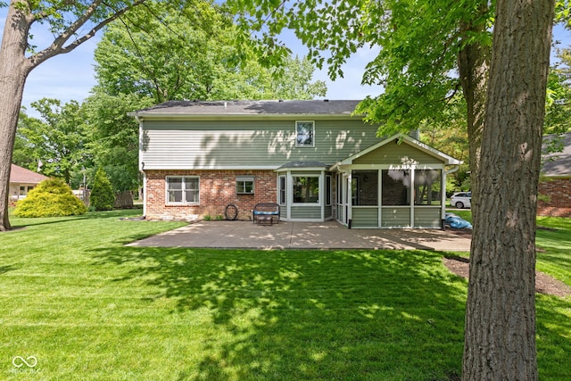 8934 Pinyon Ct, Indianapolis, IN 46260 - back of house with a sunroom, a patio, a lawn, and brick siding