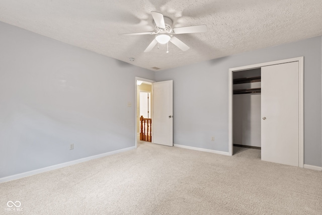 8934 Pinyon Ct, Indianapolis, IN 46260 - unfurnished bedroom with carpet flooring, a textured ceiling, baseboards, a closet, and a ceiling fan