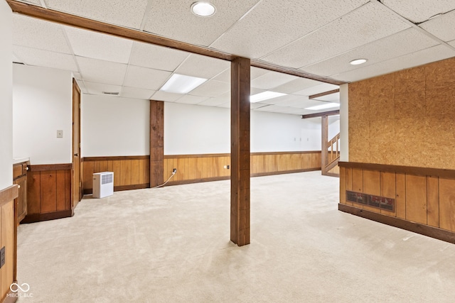 8934 Pinyon Ct, Indianapolis, IN 46260 - finished below grade area featuring a wainscoted wall, a paneled ceiling, wood walls, carpet floors, and stairway