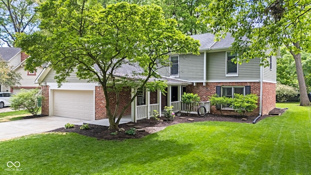 8934 Pinyon Ct, Indianapolis, IN 46260 - view of front of property with a porch, brick siding, concrete driveway, and a front yard