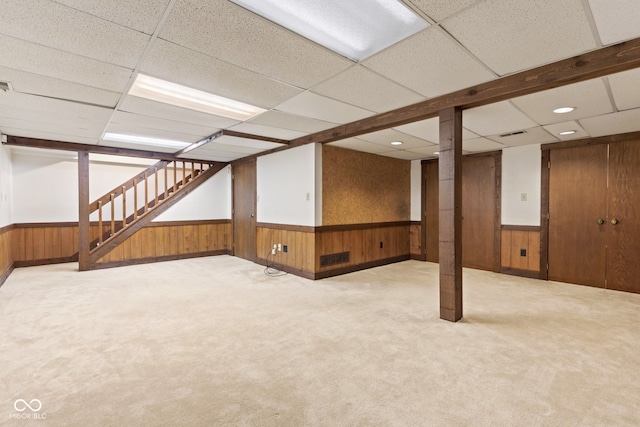8934 Pinyon Ct, Indianapolis, IN 46260 - finished basement featuring wainscoting, stairway, wooden walls, light colored carpet, and recessed lighting