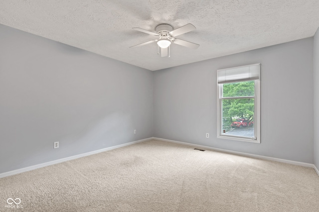 8934 Pinyon Ct, Indianapolis, IN 46260 - unfurnished room featuring carpet floors, ceiling fan, baseboards, and a textured ceiling