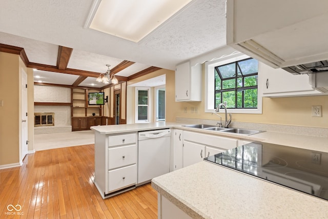 8934 Pinyon Ct, Indianapolis, IN 46260 - kitchen featuring dishwasher, a sink, a peninsula, light countertops, and coffered ceiling