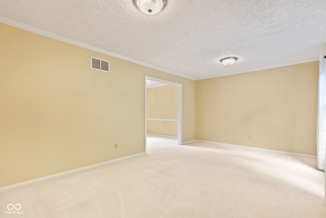8934 Pinyon Ct, Indianapolis, IN 46260 - unfurnished room featuring crown molding, a textured ceiling, light colored carpet, and baseboards