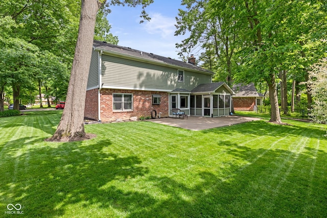 8934 Pinyon Ct, Indianapolis, IN 46260 - back of house featuring a sunroom, a patio, brick siding, and a chimney