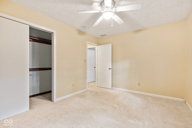 8934 Pinyon Ct, Indianapolis, IN 46260 - unfurnished bedroom featuring carpet, a textured ceiling, a closet, and baseboards