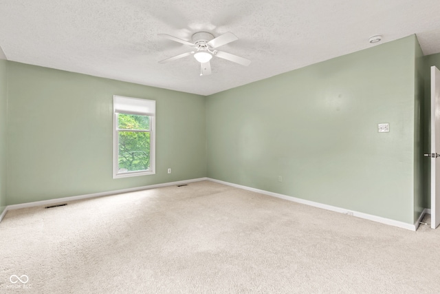 8934 Pinyon Ct, Indianapolis, IN 46260 - carpeted spare room with ceiling fan, baseboards, and a textured ceiling