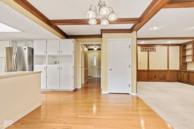 8934 Pinyon Ct, Indianapolis, IN 46260 - interior space featuring a chandelier, light wood-style flooring, beamed ceiling, recessed lighting, and baseboards