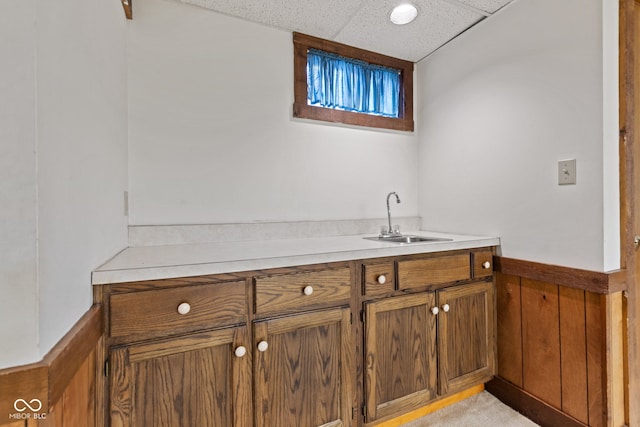 8934 Pinyon Ct, Indianapolis, IN 46260 - bar area with a sink, a drop ceiling, and wainscoting