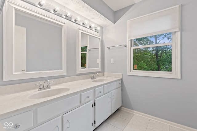 8934 Pinyon Ct, Indianapolis, IN 46260 - bathroom featuring double vanity, tile patterned flooring, and baseboards