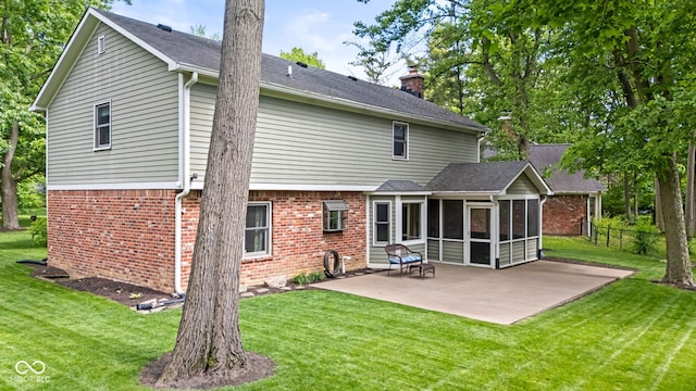 8934 Pinyon Ct, Indianapolis, IN 46260 - back of house featuring a sunroom, brick siding, a patio, and a chimney