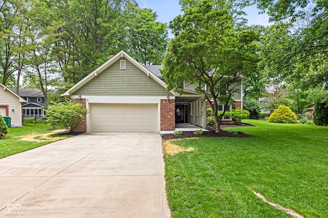 8934 Pinyon Ct, Indianapolis, IN 46260 - view of front of property featuring brick siding, driveway, a front lawn, and an attached garage