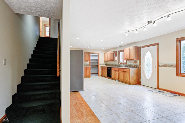 7333 State Road 42, Martinsville, IN 46151 - kitchen with freestanding refrigerator, a textured ceiling, light countertops, baseboards, and recessed lighting