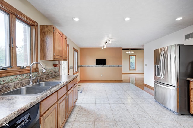 7333 State Road 42, Martinsville, IN 46151 - kitchen featuring stainless steel fridge, a sink, black dishwasher, open floor plan, and baseboards