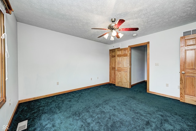 7333 State Road 42, Martinsville, IN 46151 - unfurnished bedroom with dark colored carpet, baseboards, a ceiling fan, and a textured ceiling