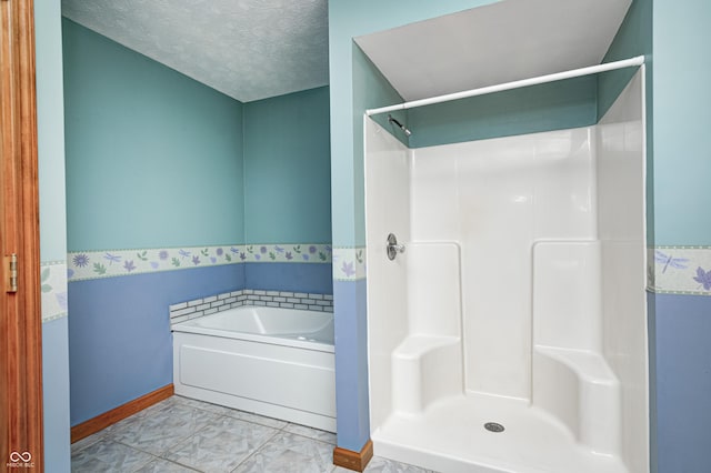7333 State Road 42, Martinsville, IN 46151 - bathroom featuring baseboards, a garden tub, a shower, and a textured ceiling