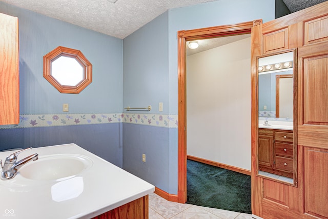 7333 State Road 42, Martinsville, IN 46151 - bathroom featuring vanity, a textured ceiling, and baseboards