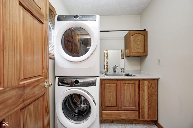 7333 State Road 42, Martinsville, IN 46151 - laundry room featuring stacked washer / dryer, cabinet space, and a textured ceiling