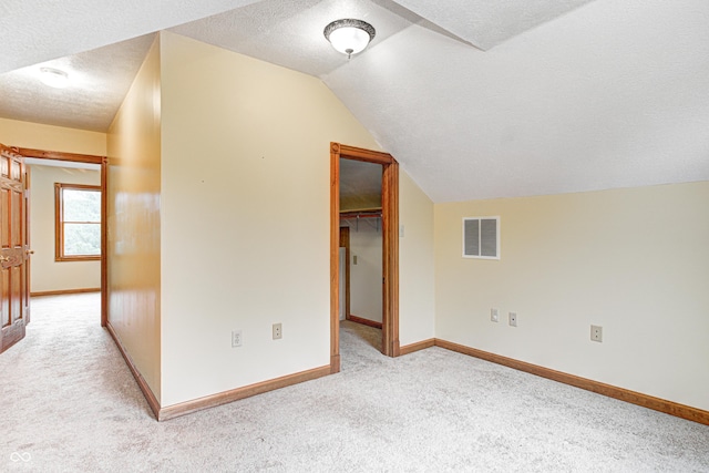 7333 State Road 42, Martinsville, IN 46151 - bonus room with carpet flooring, a textured ceiling, vaulted ceiling, and baseboards