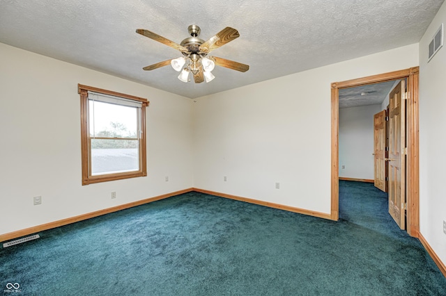 7333 State Road 42, Martinsville, IN 46151 - spare room with dark colored carpet, baseboards, a ceiling fan, and a textured ceiling