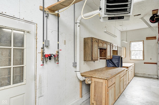 7333 State Road 42, Martinsville, IN 46151 - kitchen featuring light countertops, a heating unit, concrete flooring, and light brown cabinetry