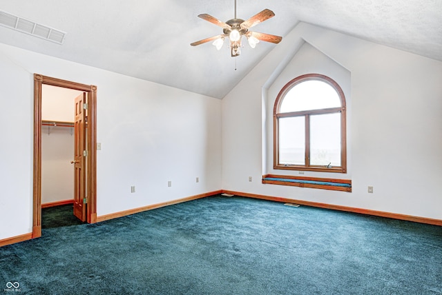 7333 State Road 42, Martinsville, IN 46151 - additional living space with dark colored carpet, ceiling fan, vaulted ceiling, and baseboards