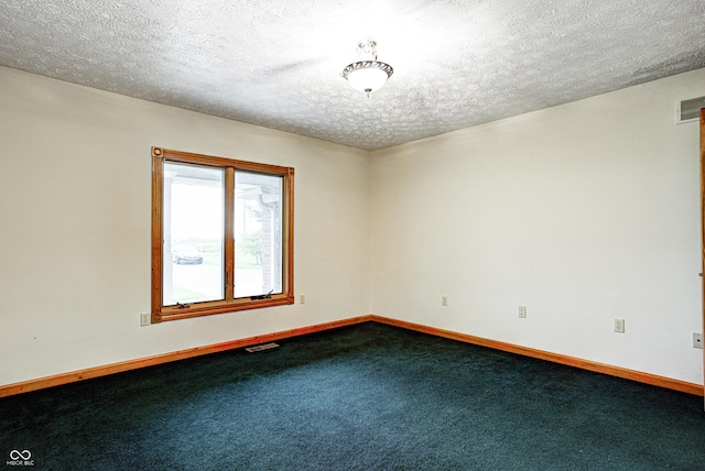 7333 State Road 42, Martinsville, IN 46151 - spare room featuring dark colored carpet, baseboards, and a textured ceiling